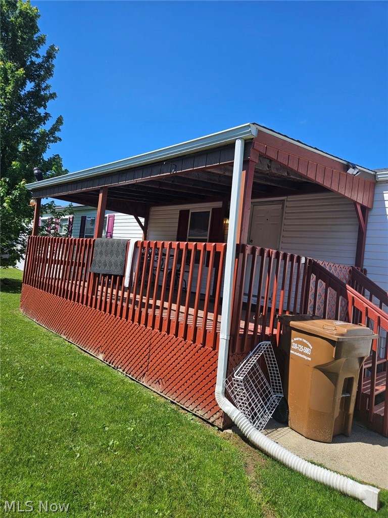 5974 Cleveland Road, Unit 11 Wooster, OH 44691 - Photo 3 of 13 Back of house featuring a lawn