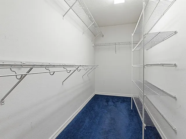 a view of a room with racks on the wall