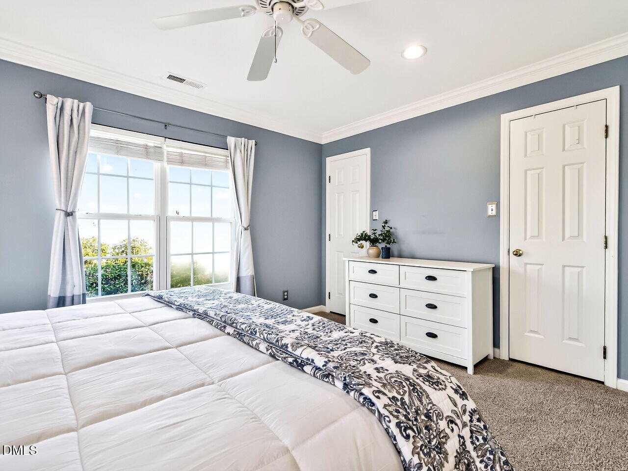 422 Intern Way Durham, NC 27713 - Photo 19 of 33 a bedroom with a bed and a window