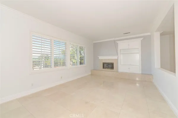 a view of a dining room with furniture and windows