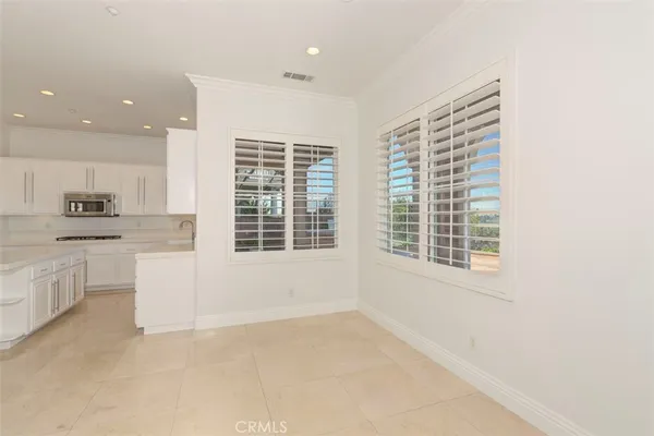 a living room with furniture window and wooden floor