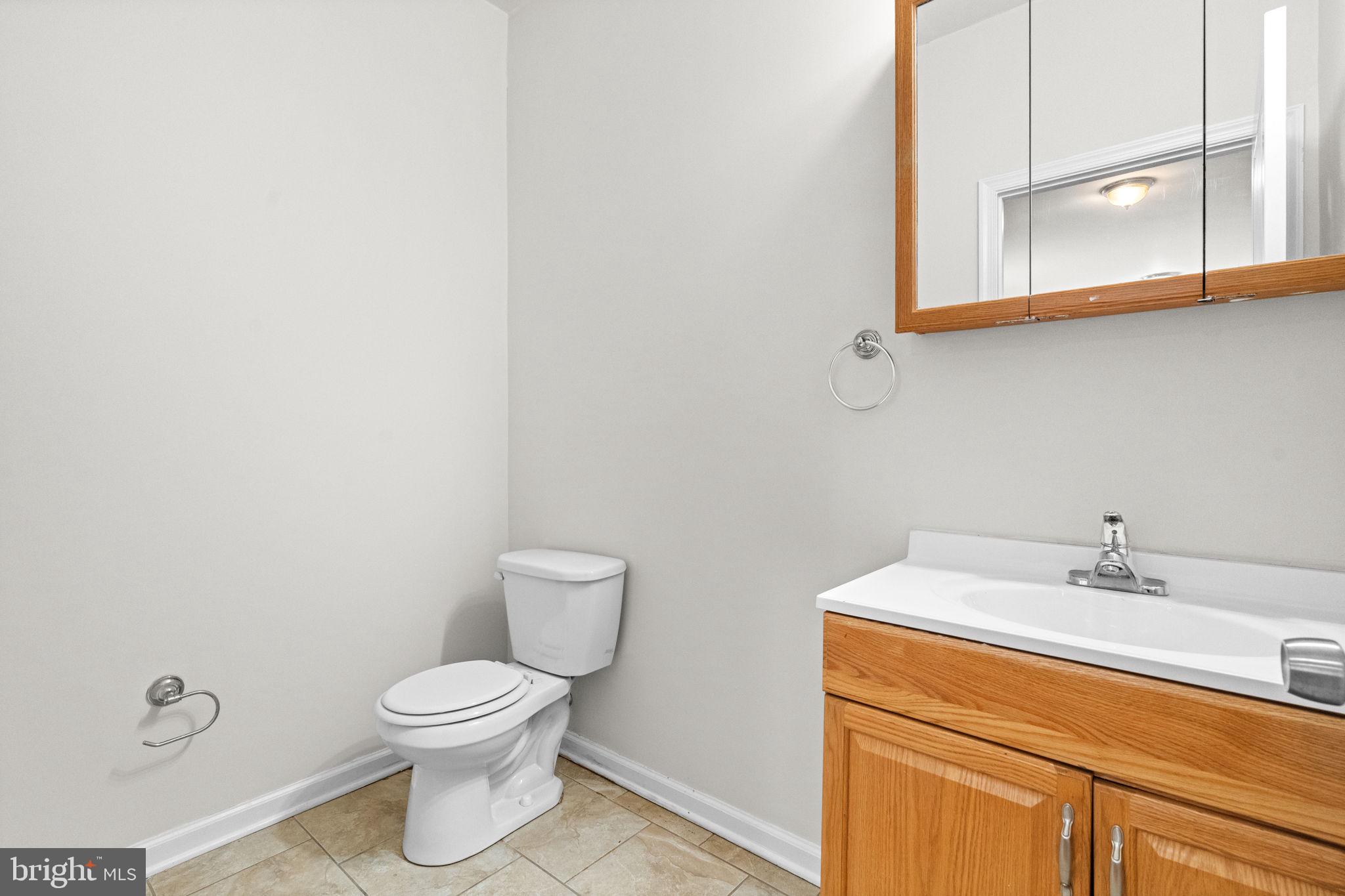 2106 North 17th Street Philadelphia, PA 19121 - Photo 17 of 84 a bathroom with a sink a toilet and mirror