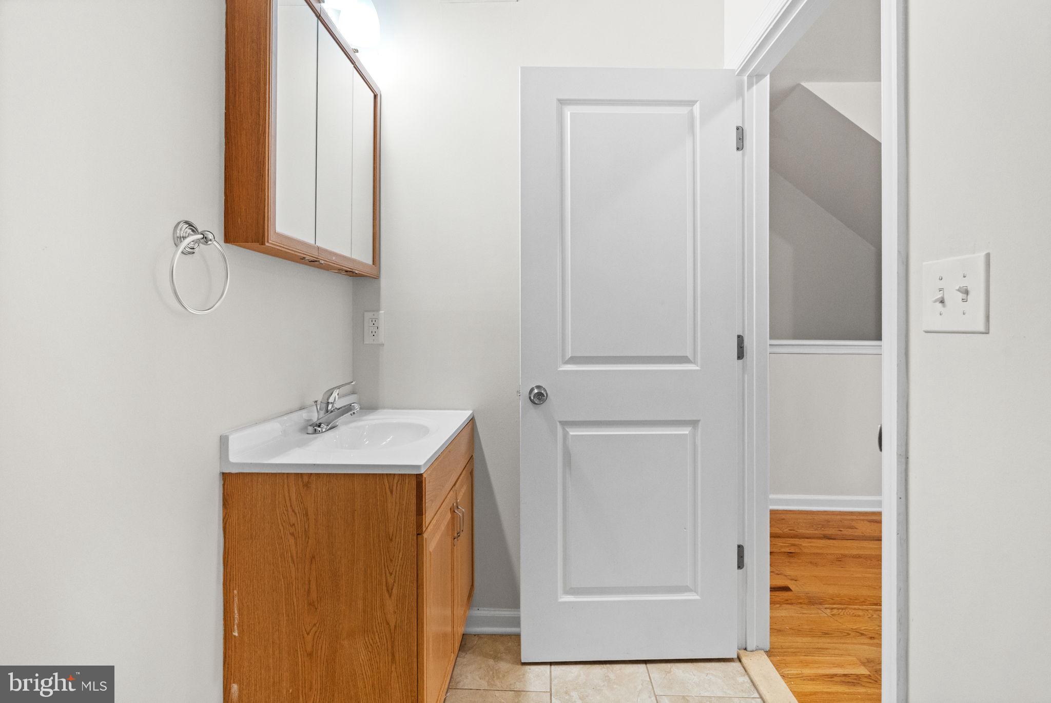 2106 North 17th Street Philadelphia, PA 19121 - Photo 18 of 84 a bathroom with a sink and a mirror