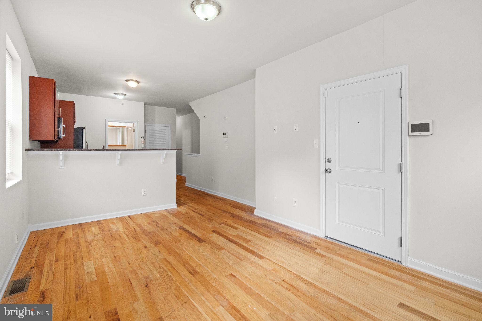 2106 North 17th Street Philadelphia, PA 19121 - Photo 21 of 84 a view of a kitchen with wooden floor and a sink