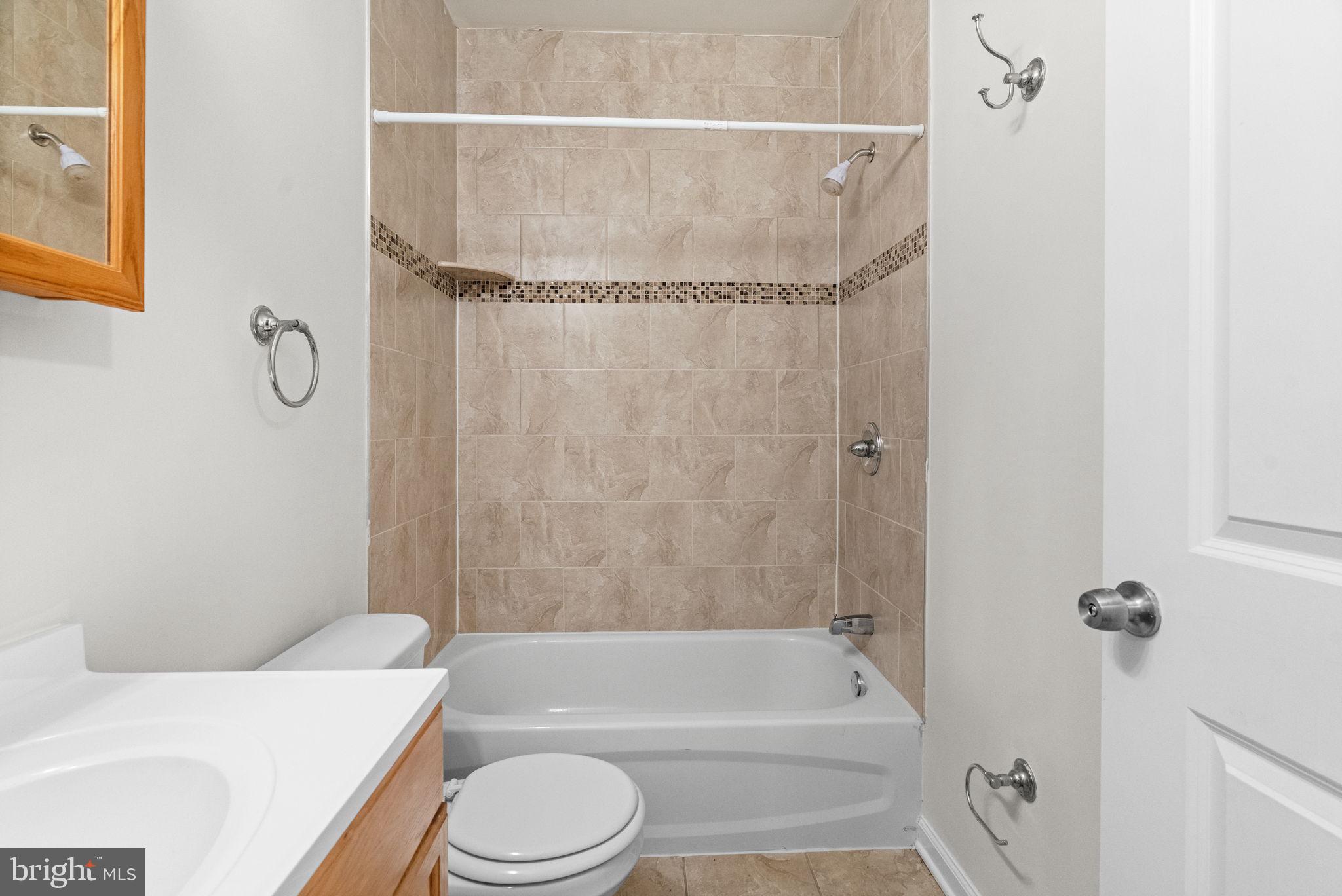 2106 North 17th Street Philadelphia, PA 19121 - Photo 26 of 84 a bathroom with a bathtub shower sink vanity and toilet