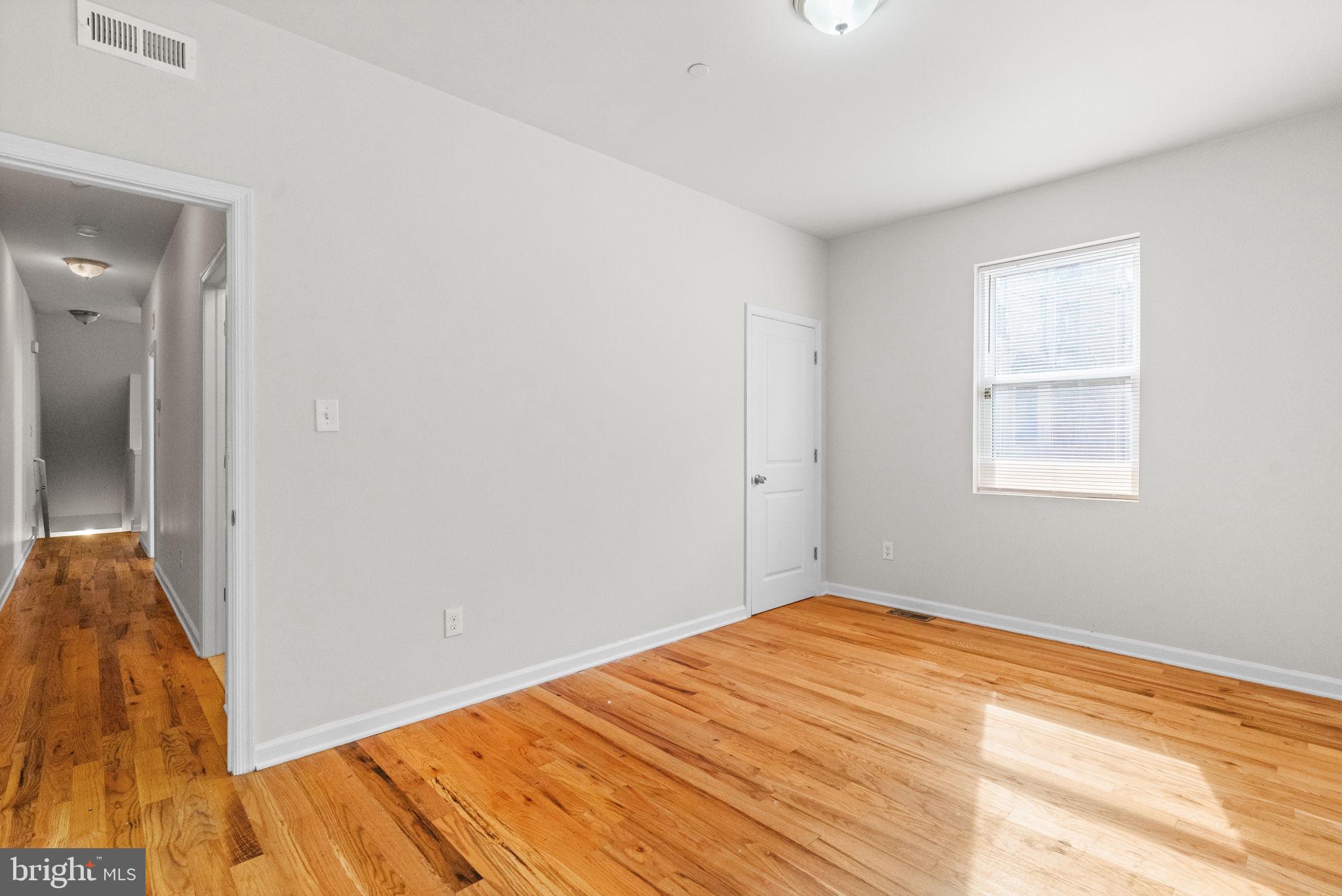 2106 North 17th Street Philadelphia, PA 19121 - Photo 3 of 84 a view of empty room with wooden floor