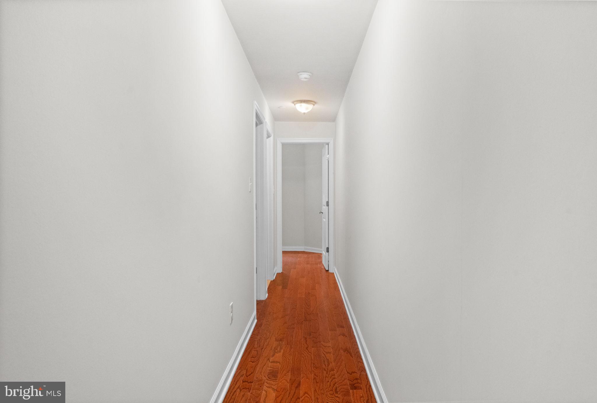 2106 North 17th Street Philadelphia, PA 19121 - Photo 33 of 84 a view of a hallway with wooden floor and staircase