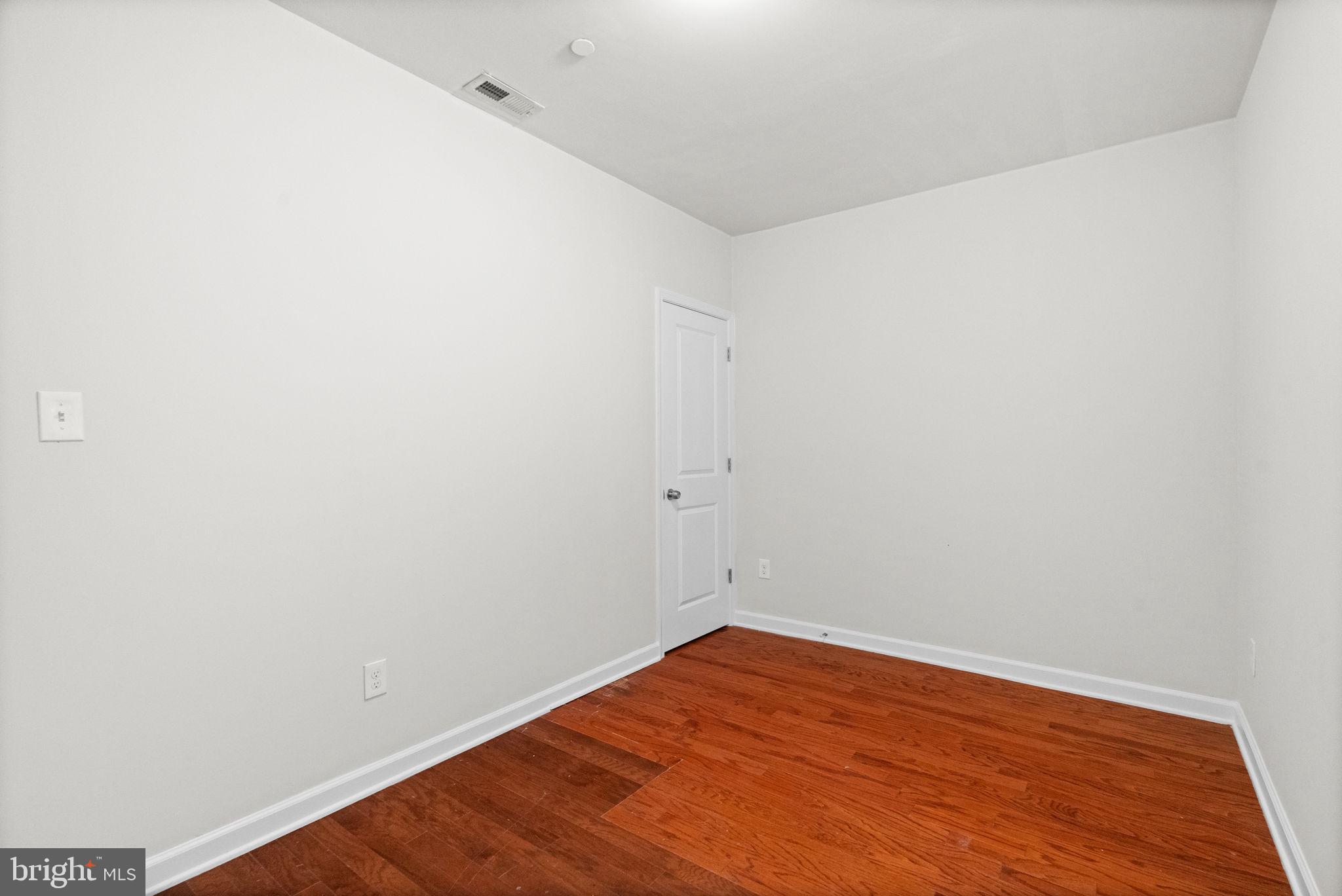2106 North 17th Street Philadelphia, PA 19121 - Photo 35 of 84 a view of empty room with wooden floor