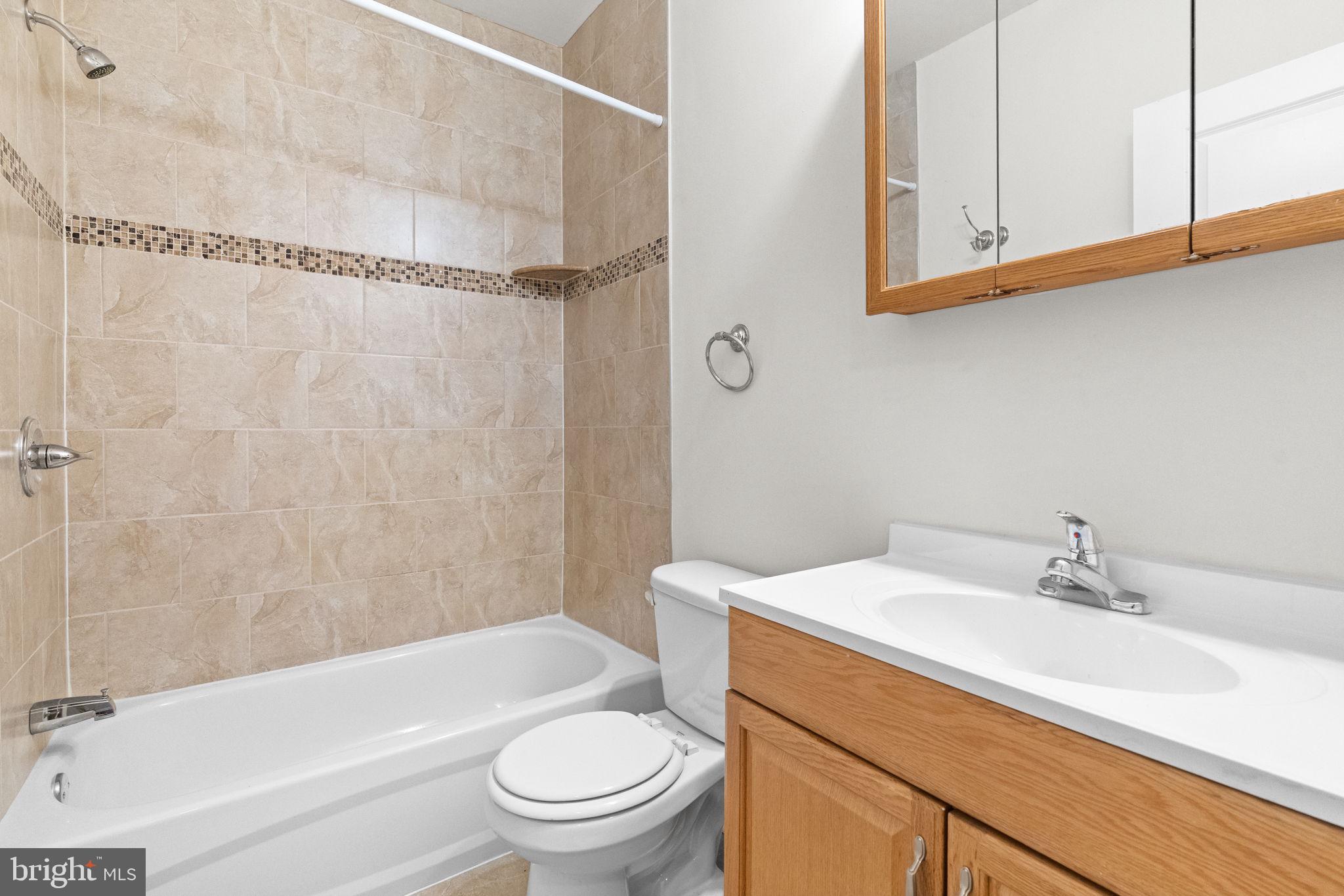 2106 North 17th Street Philadelphia, PA 19121 - Photo 38 of 84 a bathroom with a sink a toilet and shower