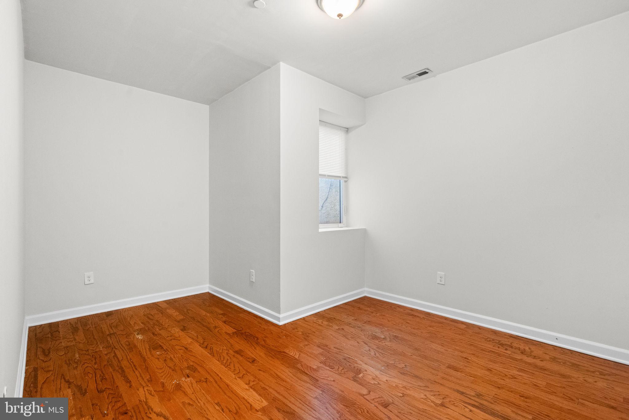2106 North 17th Street Philadelphia, PA 19121 - Photo 39 of 84 a view of empty room with wooden floor