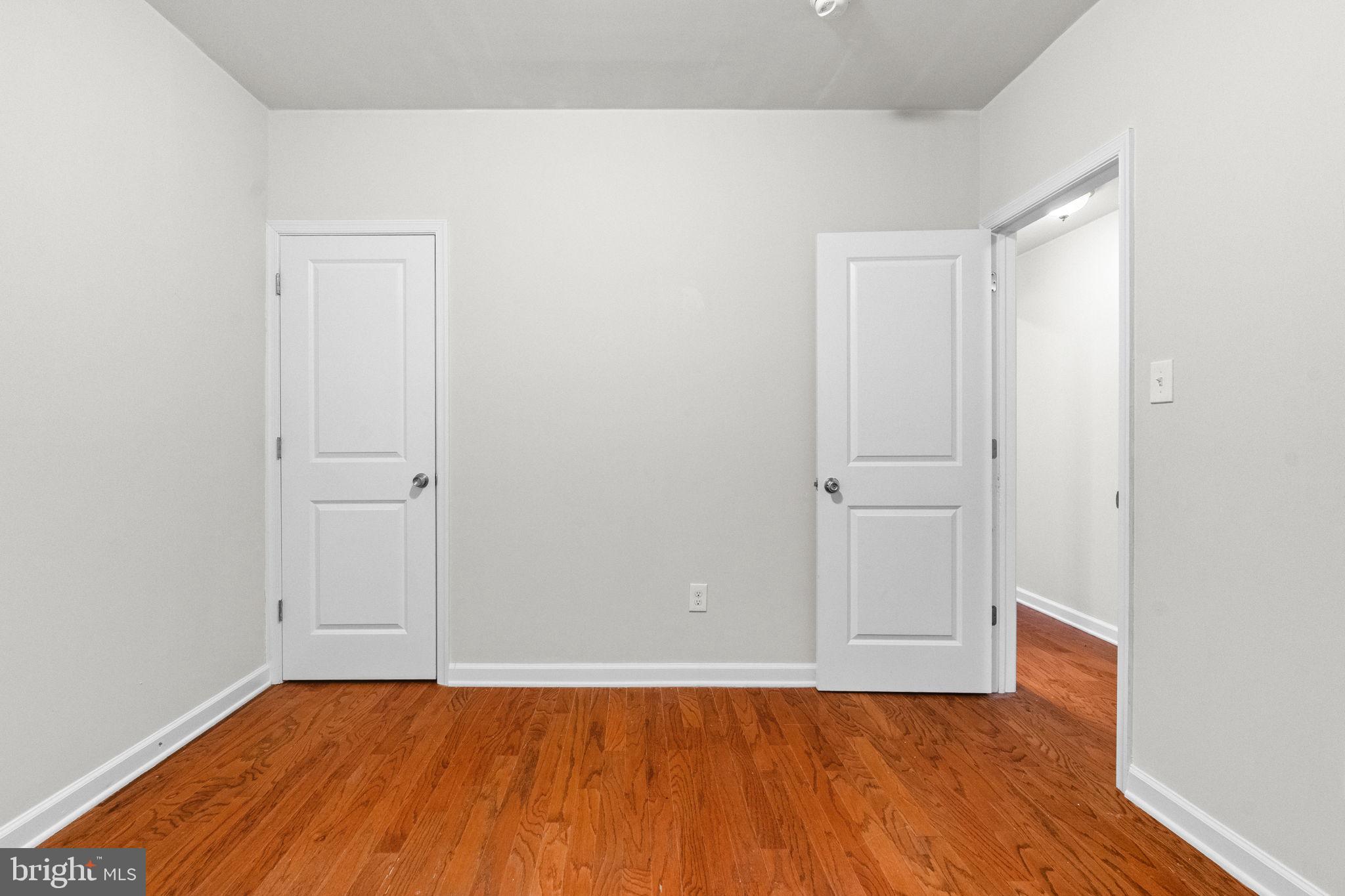 2106 North 17th Street Philadelphia, PA 19121 - Photo 42 of 84 a view of an empty room with wooden floor and closet