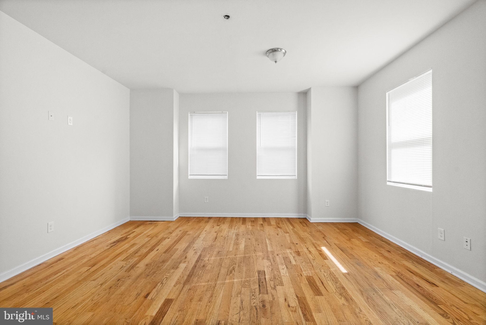 2106 North 17th Street Philadelphia, PA 19121 - Photo 52 of 84 a view of empty room with wooden floor and fan