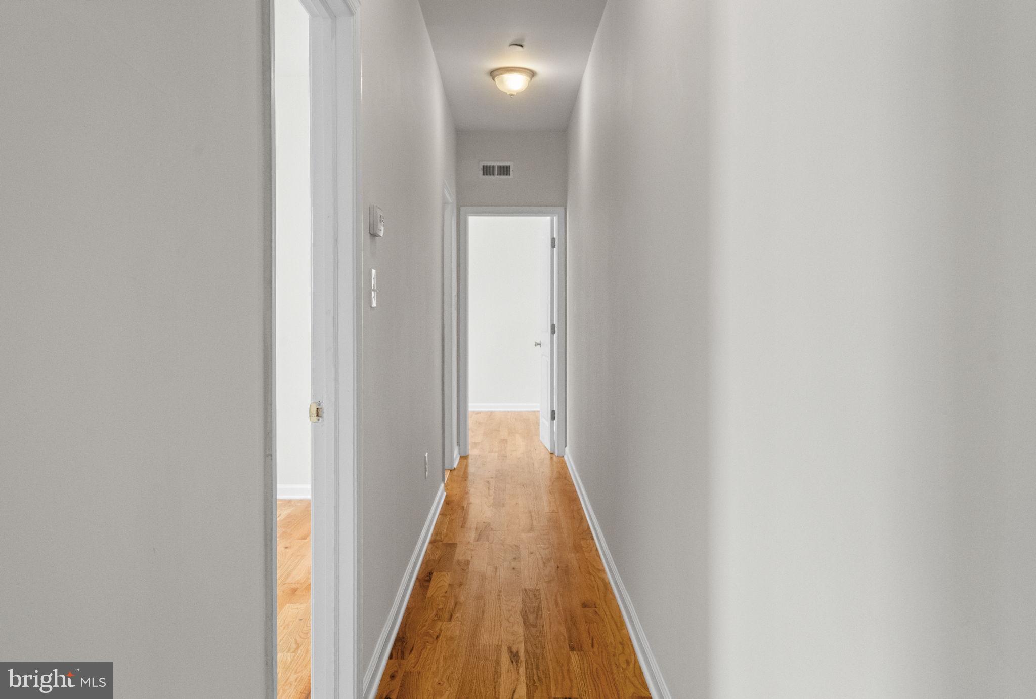 2106 North 17th Street Philadelphia, PA 19121 - Photo 6 of 84 a view of a hallway with wooden floor and staircase