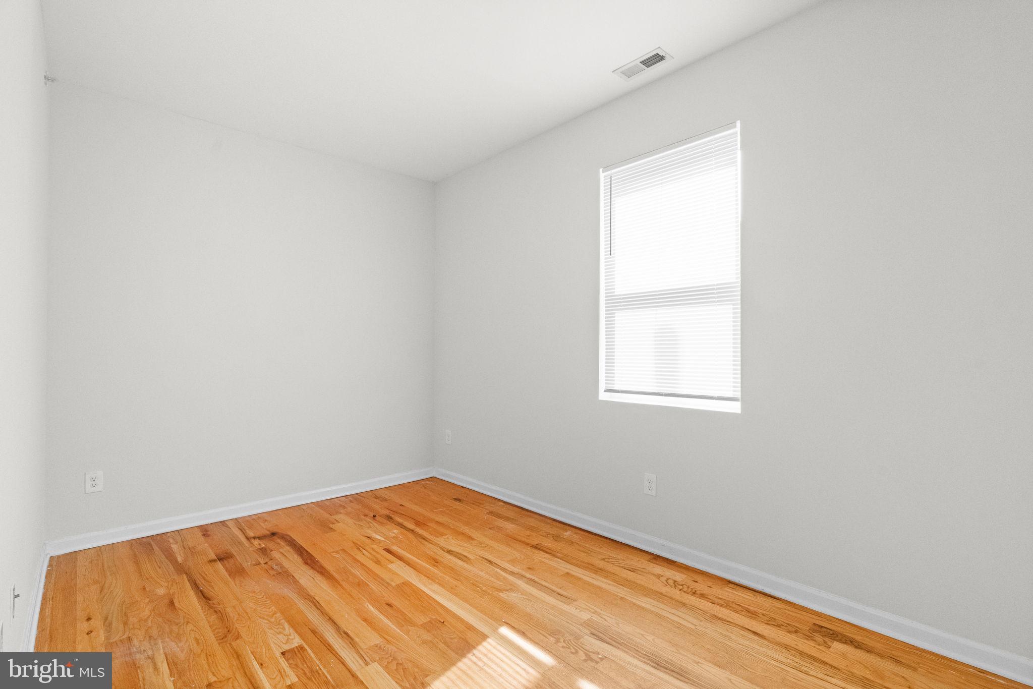 2106 North 17th Street Philadelphia, PA 19121 - Photo 66 of 84 a view of a room with a wooden floor and a window