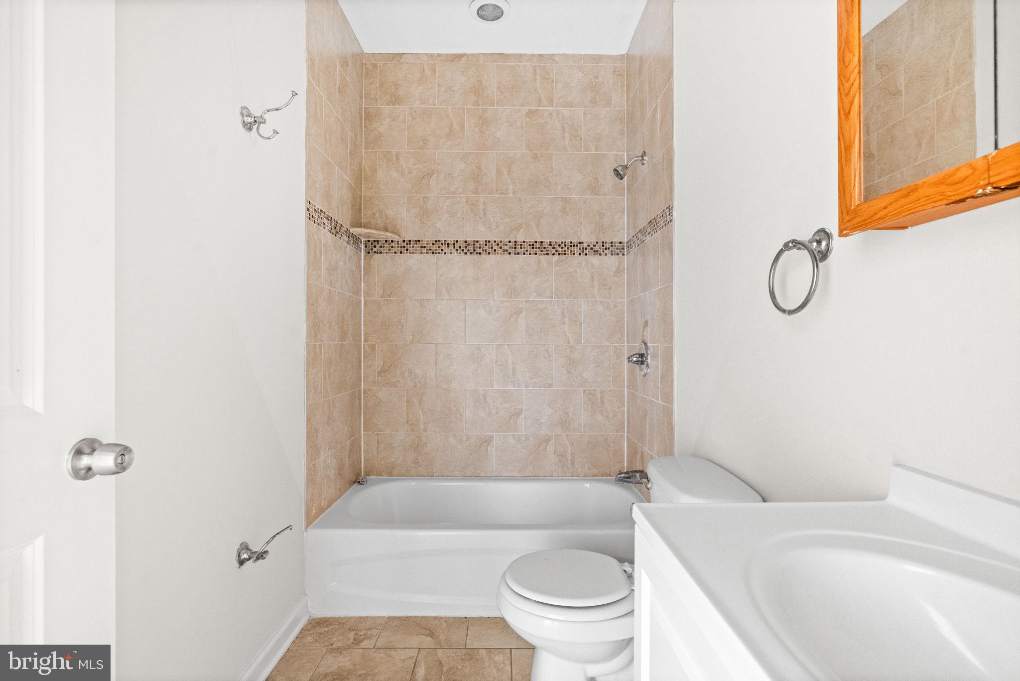 2106 North 17th Street Philadelphia, PA 19121 - Photo 69 of 84 a bathroom with a toilet and a shower