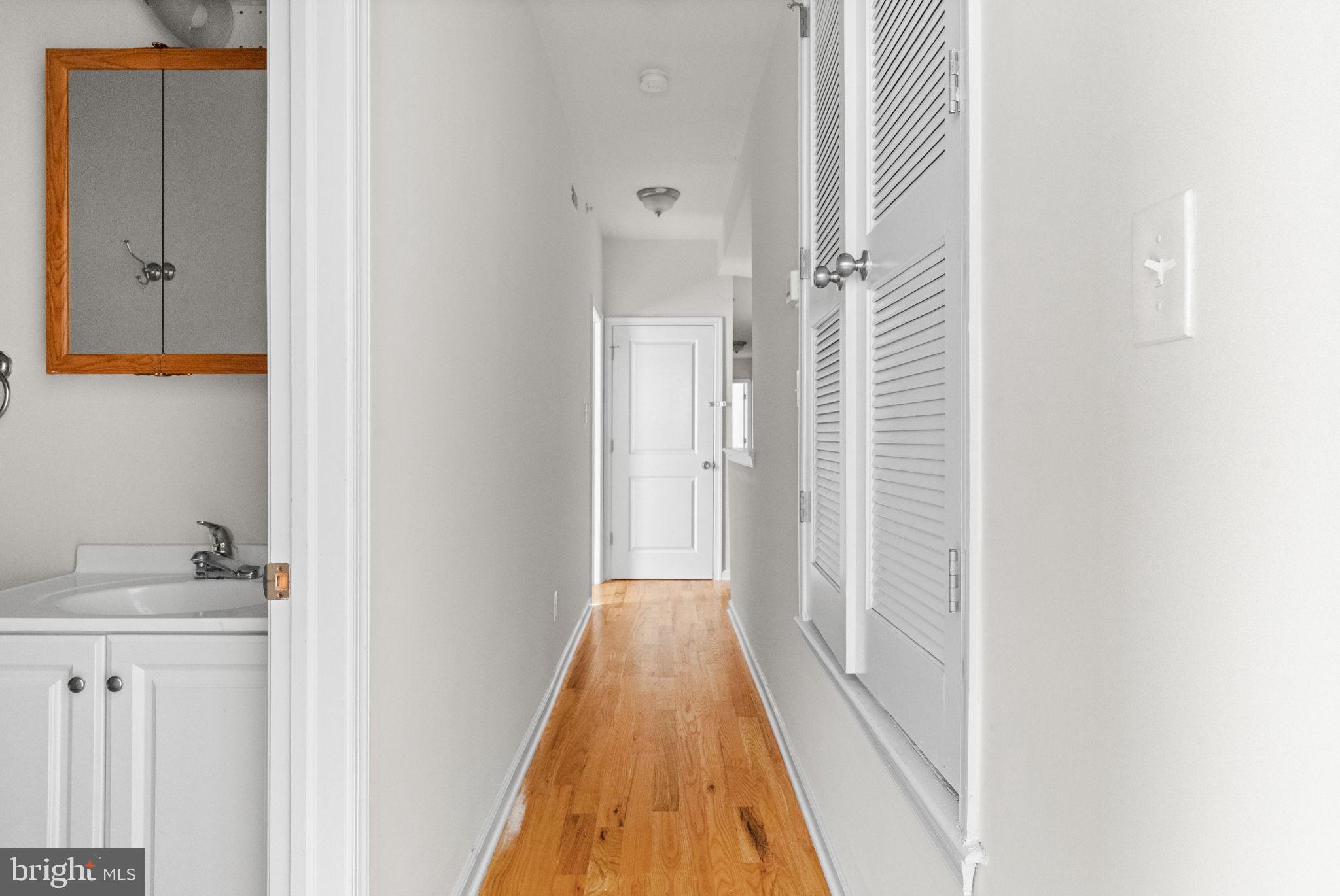 2106 North 17th Street Philadelphia, PA 19121 - Photo 71 of 84 a view of a hallway with wooden floor and staircase
