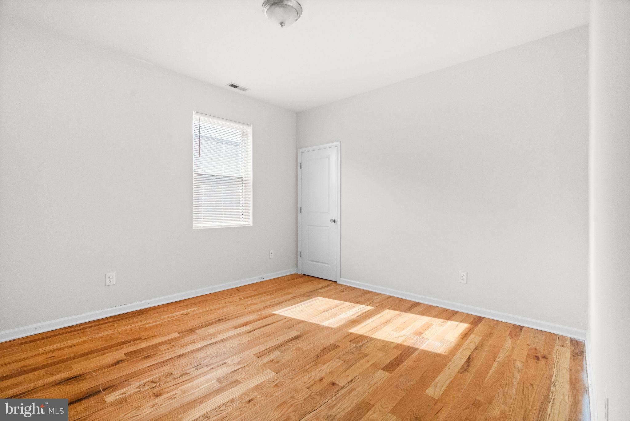 2106 North 17th Street Philadelphia, PA 19121 - Photo 76 of 84 a view of empty room with wooden floor and fan