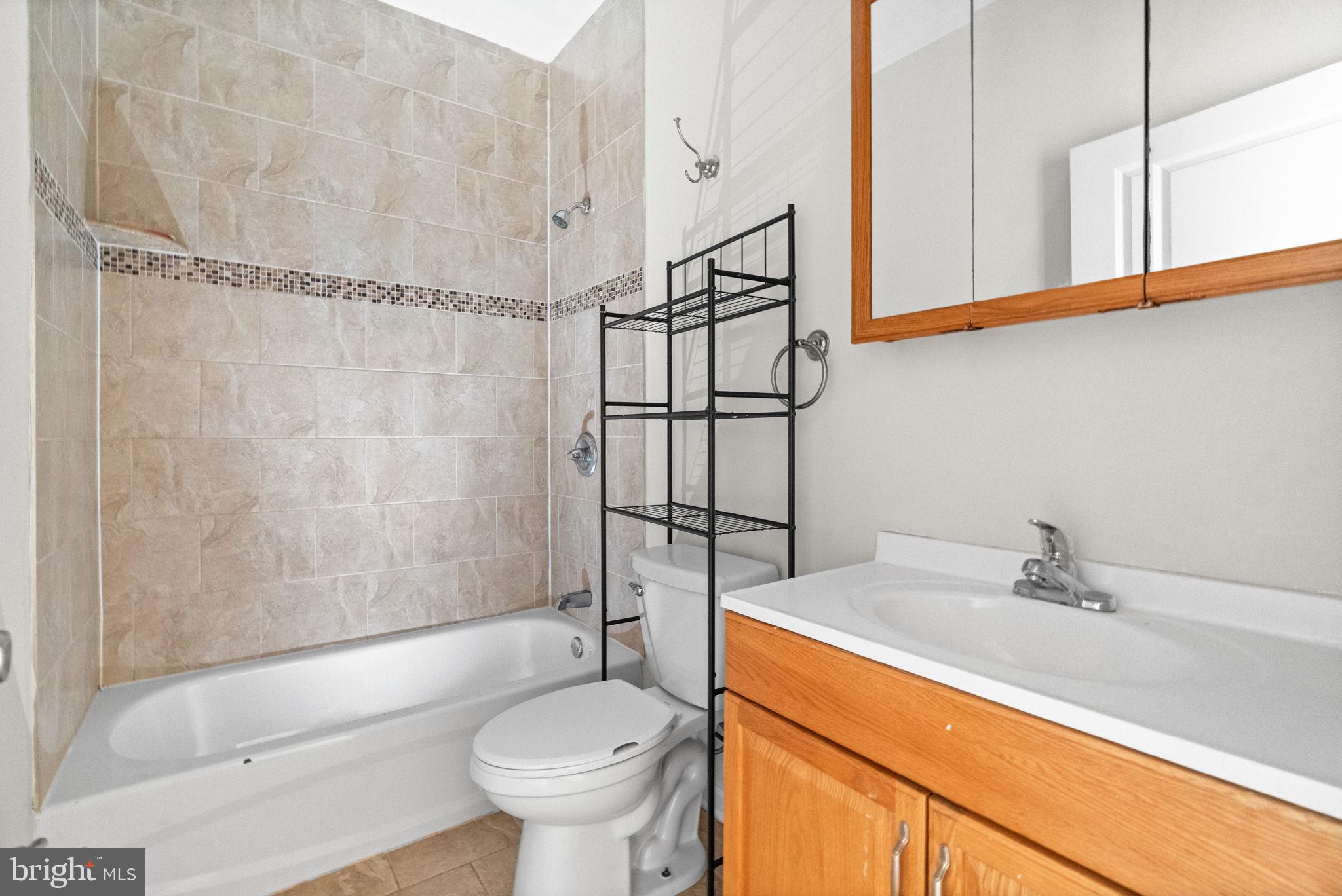 2106 North 17th Street Philadelphia, PA 19121 - Photo 81 of 84 a bathroom with a sink a toilet and shower