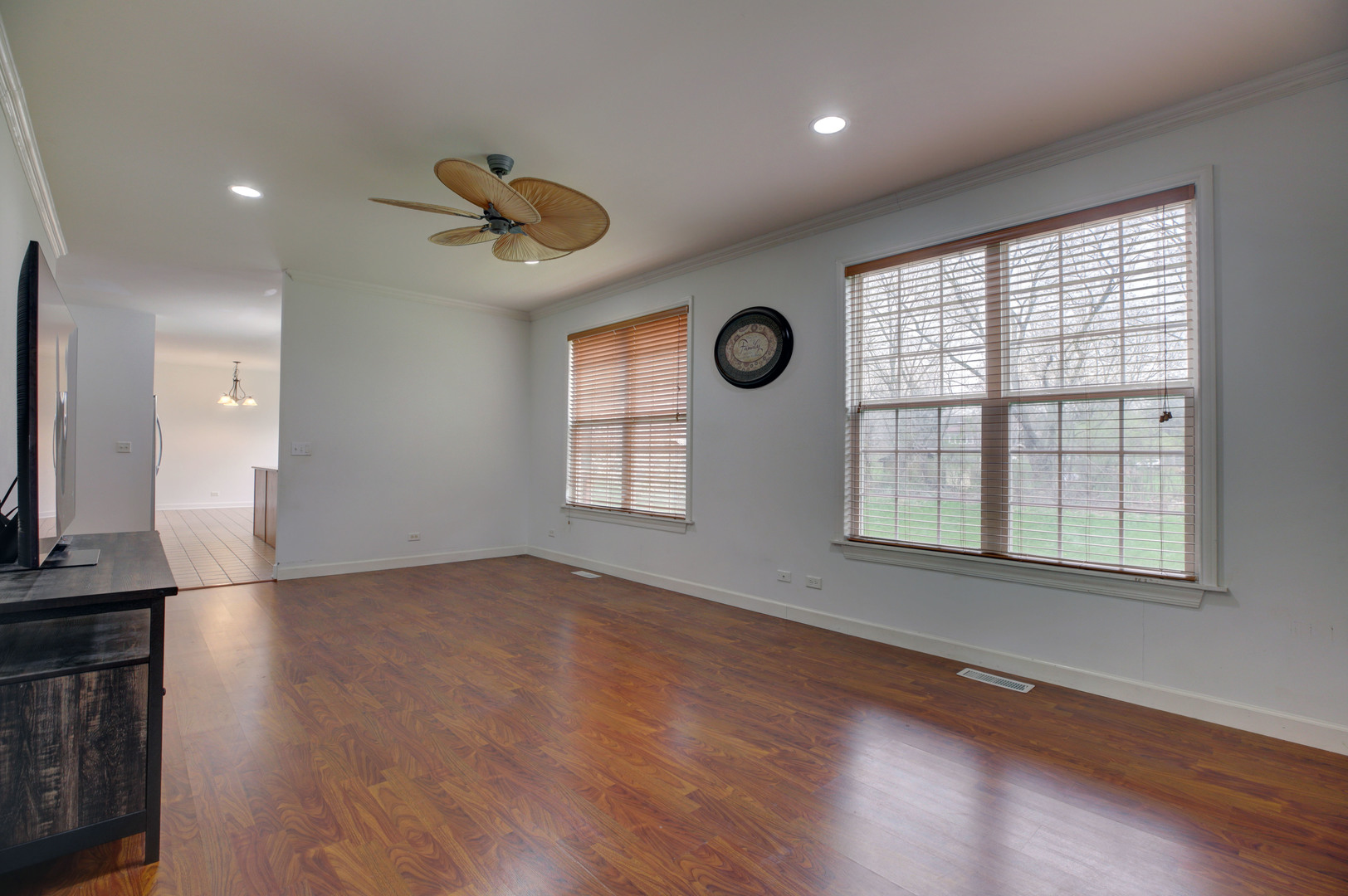 863 Oak Ridge Boulevard Elgin, IL 60120 - Photo 18 of 46 an empty room with wooden floor and windows