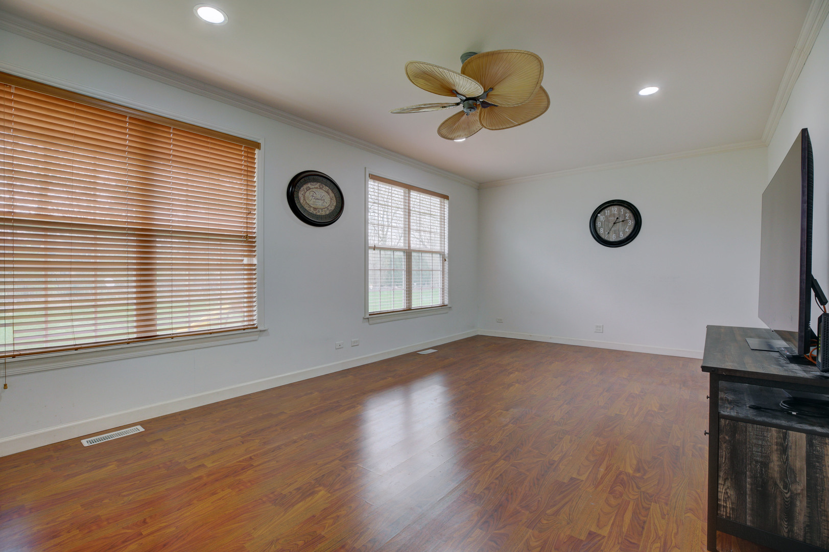 863 Oak Ridge Boulevard Elgin, IL 60120 - Photo 19 of 46 a view of an empty room with wooden floor and a window