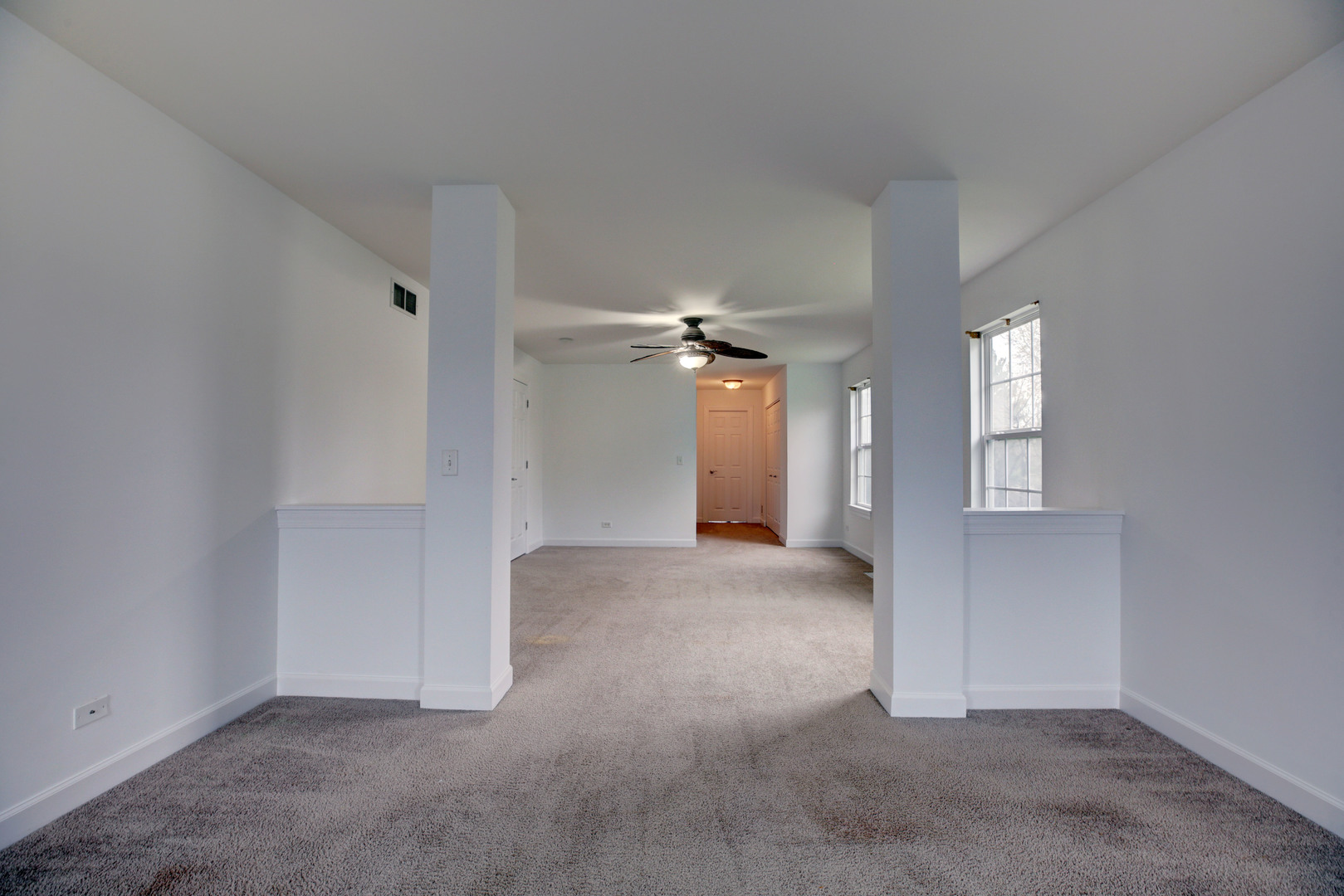 863 Oak Ridge Boulevard Elgin, IL 60120 - Photo 30 of 46 an empty room with windows and fan