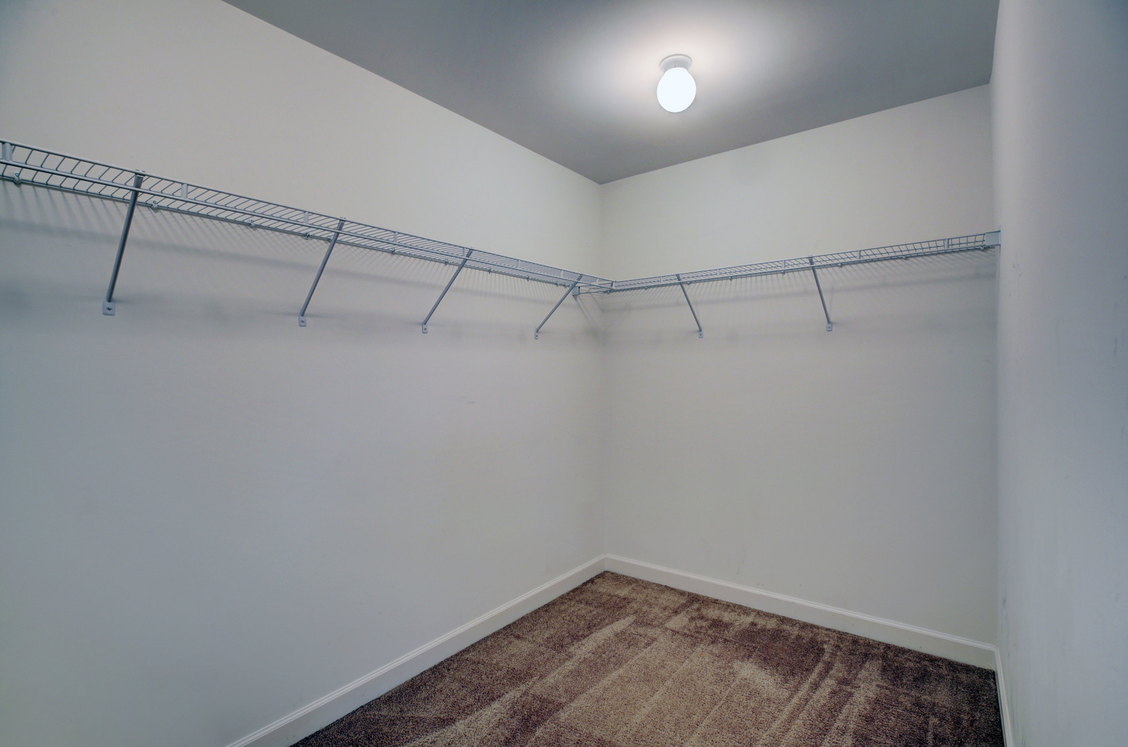 863 Oak Ridge Boulevard Elgin, IL 60120 - Photo 32 of 46 a view of a room with racks on the wall
