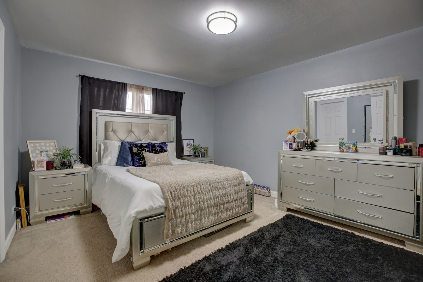 863 Oak Ridge Boulevard Elgin, IL 60120 - Photo 35 of 46 a bedroom with a bed and a dresser