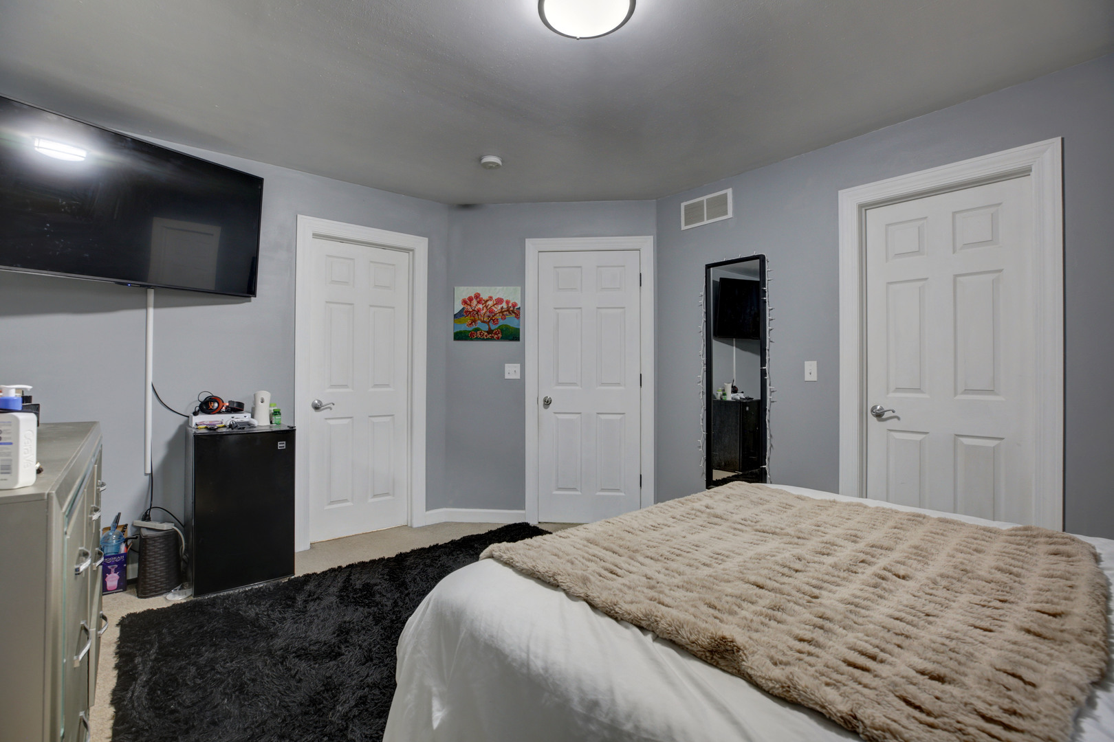 863 Oak Ridge Boulevard Elgin, IL 60120 - Photo 36 of 46 a bedroom with a bed and a flat screen tv