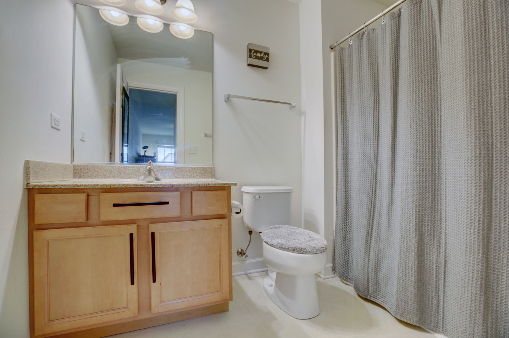 863 Oak Ridge Boulevard Elgin, IL 60120 - Photo 42 of 46 a bathroom with a sink toilet and shower