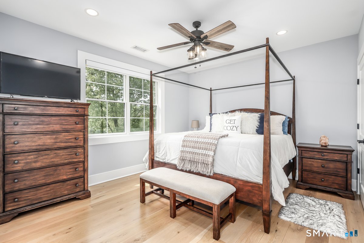 2 Pond View Lane Sherman, CT 06784 - Photo 25 of 40 a bedroom with a bed a desk and chair