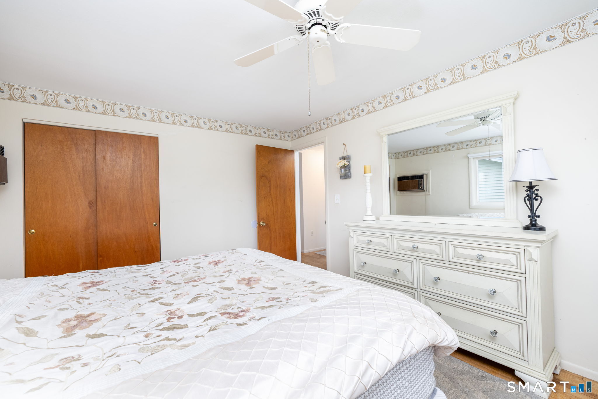 325 Barbara Road Middletown, CT 06457 - Photo 26 of 40 a bedroom with a large bed and a chandelier