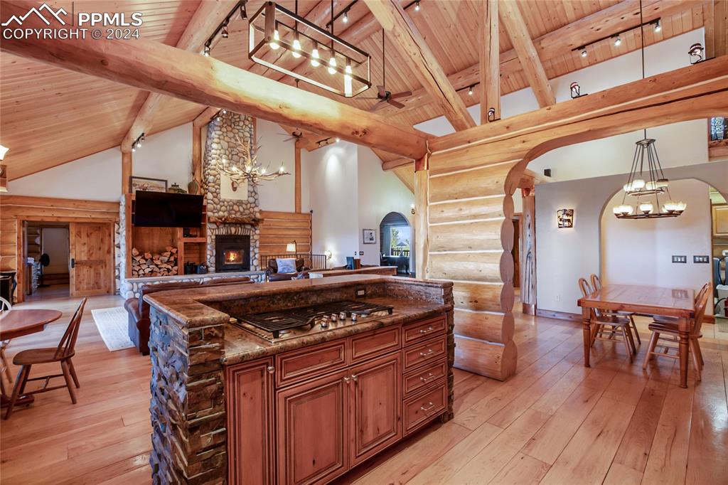 616 Summit Road Hartsel, CO 80449 - Photo 16 of 50 a kitchen with stainless steel appliances granite countertop a stove and a wooden floors