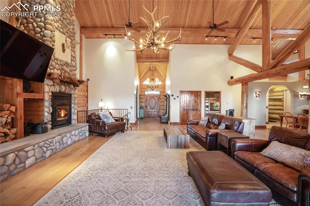 616 Summit Road Hartsel, CO 80449 - Photo 18 of 50 a living room with fireplace furniture and a flat screen tv