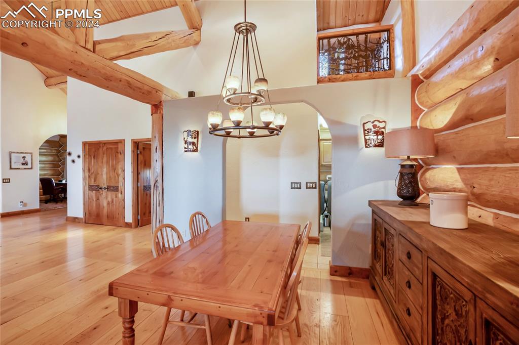 616 Summit Road Hartsel, CO 80449 - Photo 23 of 50 a dining room with furniture and chandelier