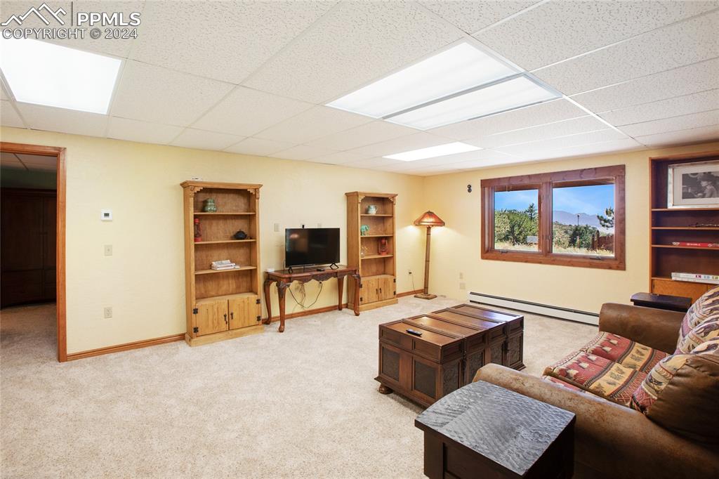 616 Summit Road Hartsel, CO 80449 - Photo 37 of 50 a living room with furniture and a flat screen tv