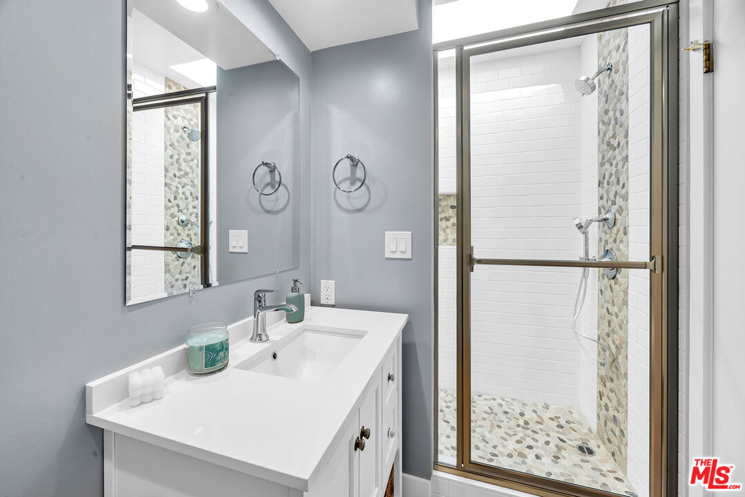 25444 Malibu Road Malibu, CA 90265 - Photo 13 of 15 a bathroom with a sink and a mirror