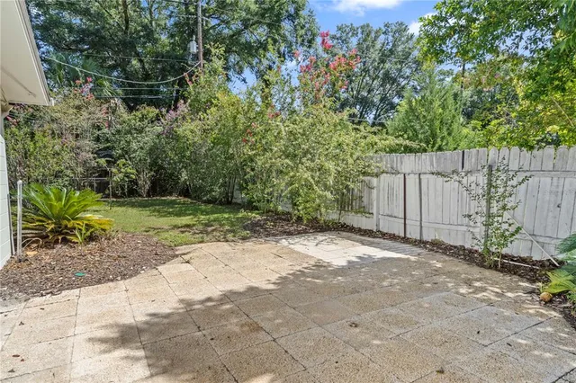 a backyard of a house with lots of green space
