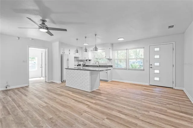 a view of kitchen with wooden floor