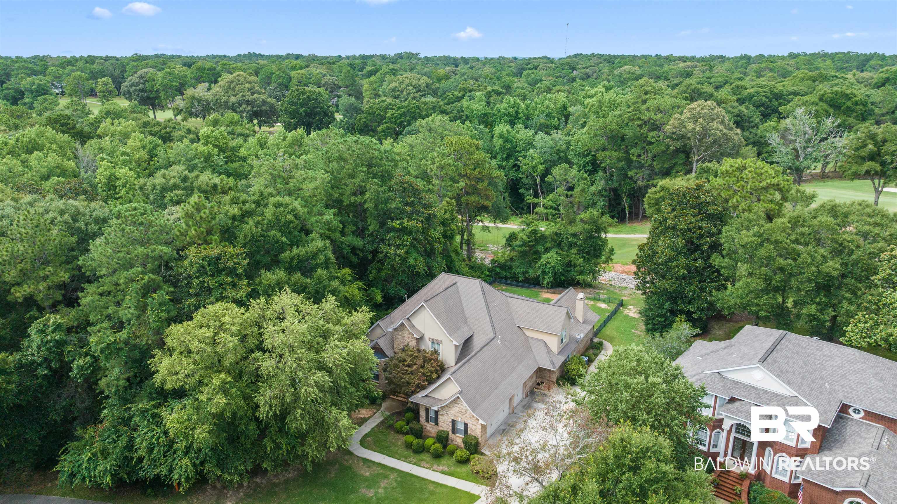 30463 Dolive Ridge Daphne, AL 36527 - Photo 5 of 58 Expansive property featuring a stone and siding exterior, multi-gabled roofline, and mature landscaping