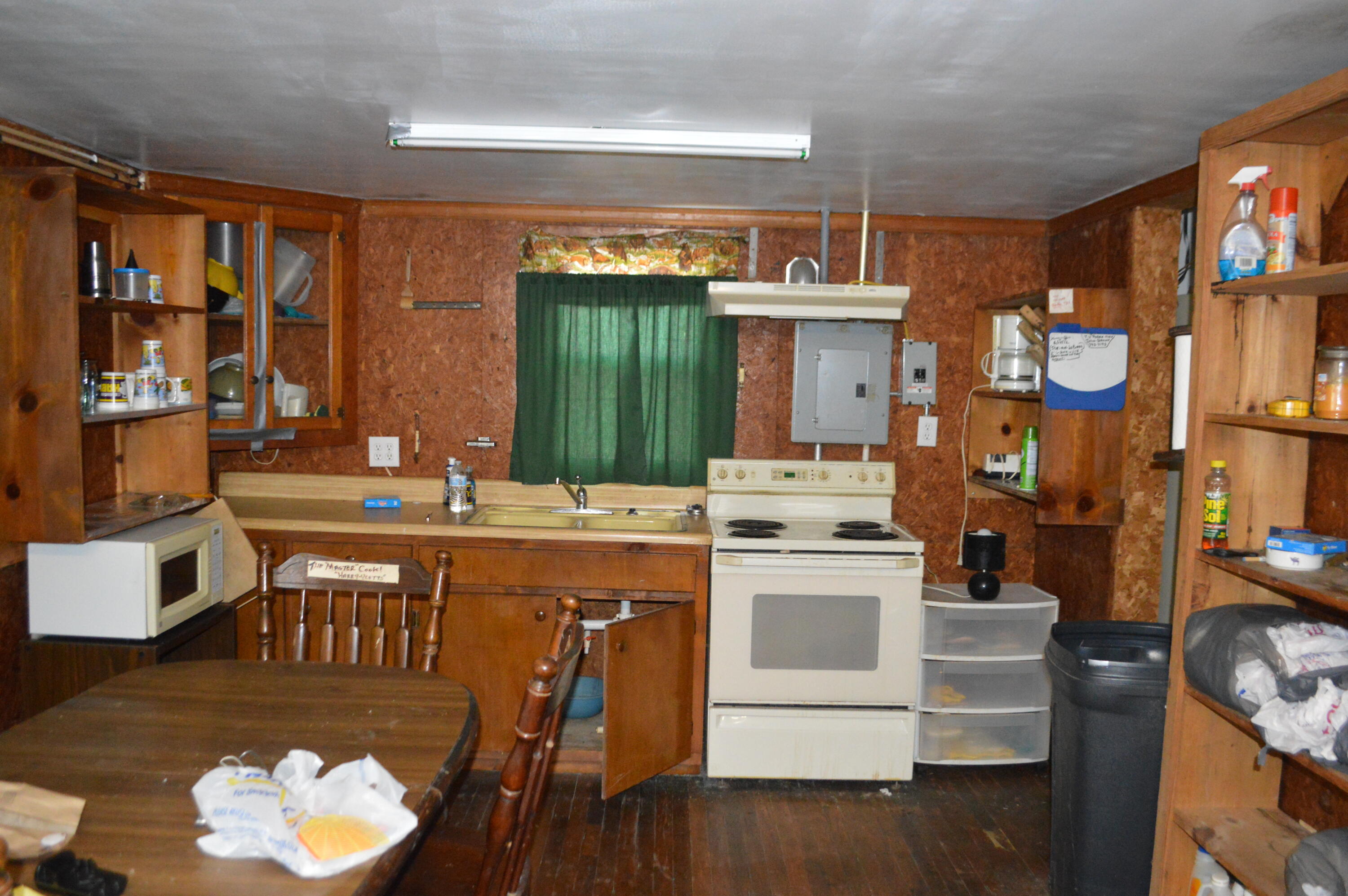 4140 Peaceful Valley Road New Castle, VA 24127 - Photo 14 of 14 a kitchen with a table chairs stove and cabinets