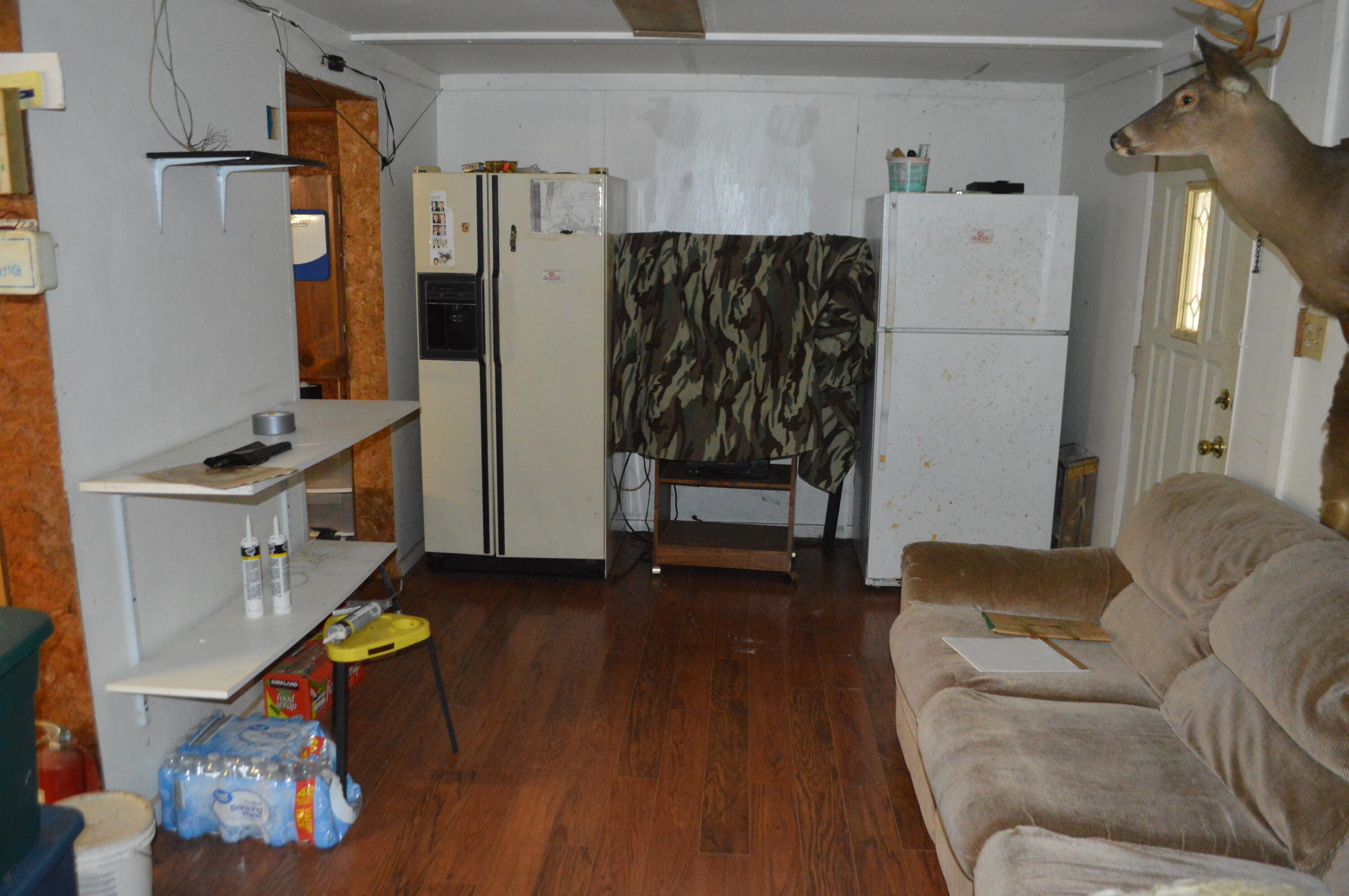 4140 Peaceful Valley Road New Castle, VA 24127 - Photo 3 of 14 a living room with furniture and a refrigerator