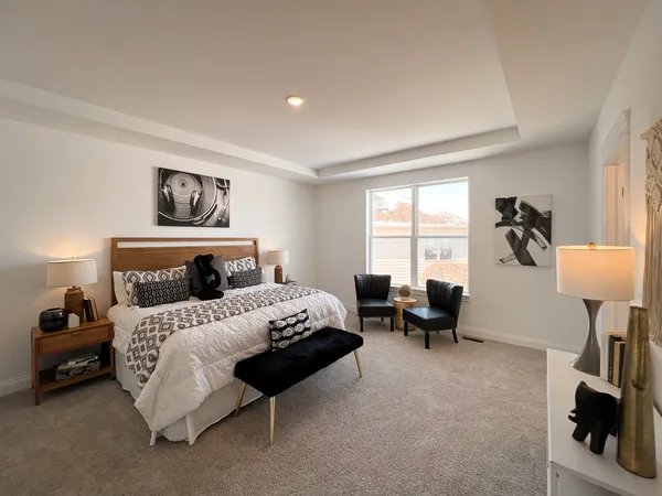 a bedroom with bed and a window