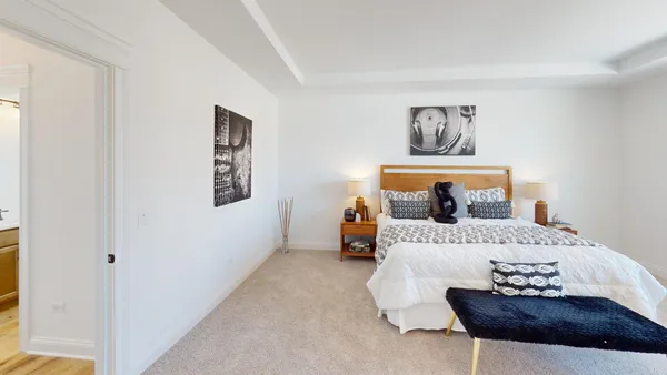 a bedroom with a bed and a couch