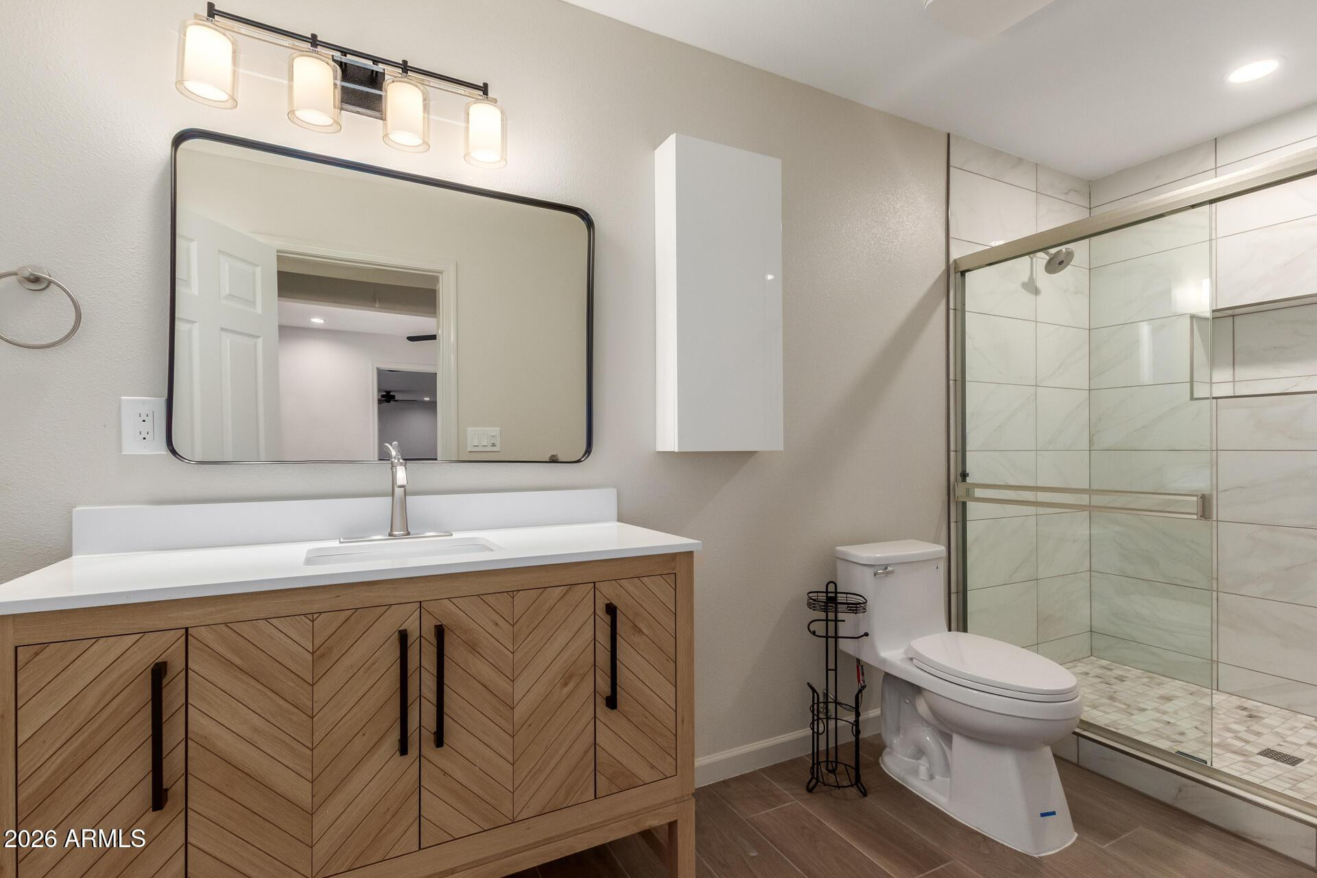 1628 East Del Rio Drive Tempe, AZ 85282 - Photo 15 of 32 a bathroom with a toilet a sink and mirror