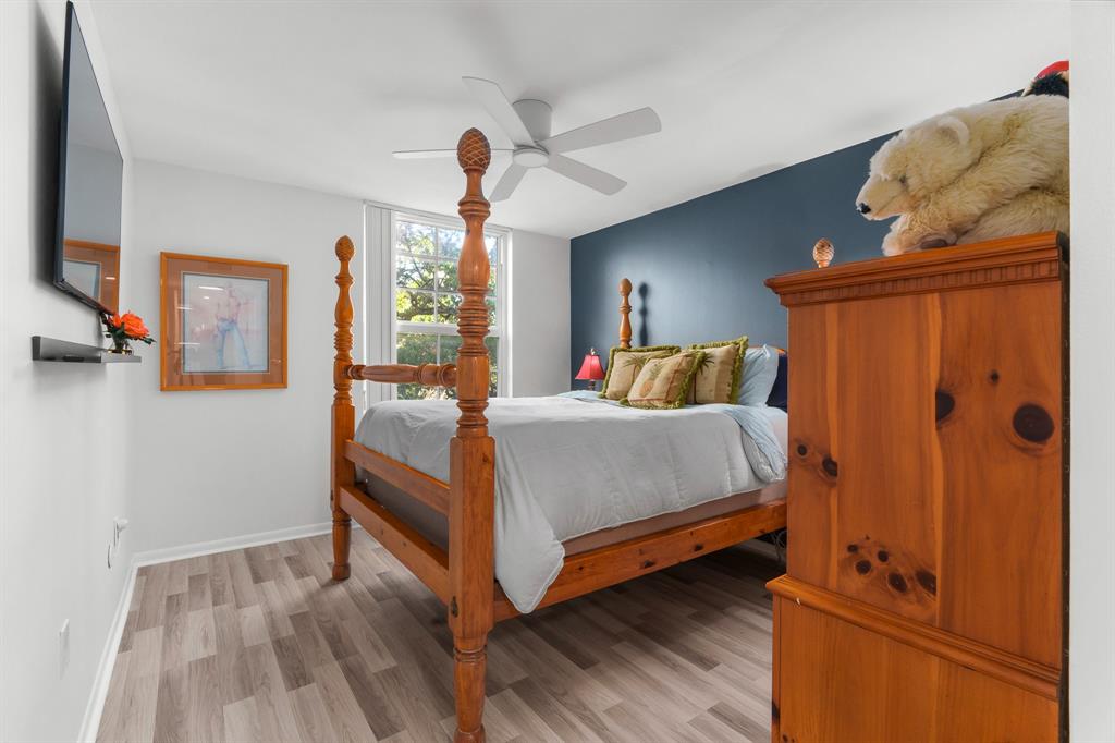 520 Southeast 5th Avenue, Unit 2209 Fort Lauderdale, FL 33301 - Photo 17 of 47 a bedroom with a bed and wooden floor