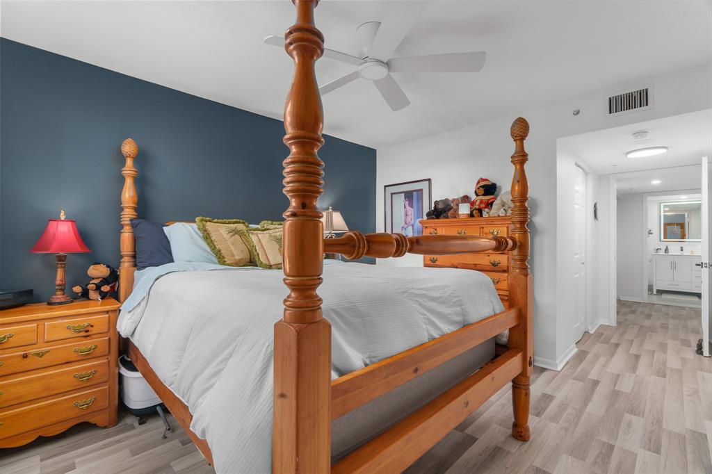 520 Southeast 5th Avenue, Unit 2209 Fort Lauderdale, FL 33301 - Photo 18 of 47 a bedroom with bed and wooden floor