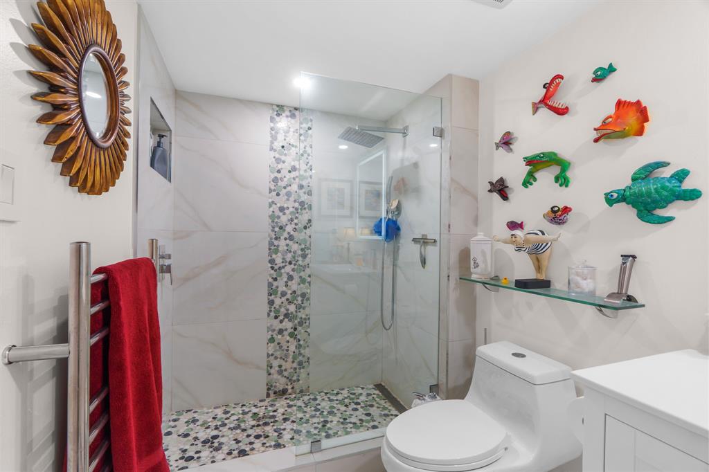 520 Southeast 5th Avenue, Unit 2209 Fort Lauderdale, FL 33301 - Photo 22 of 47 a bathroom with a toilet sink and shower curtain