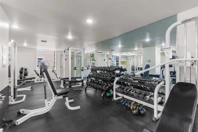 a view of a kitchen with dining area and chandelier