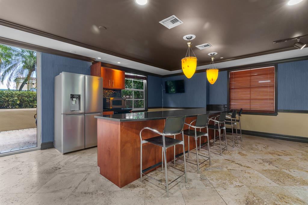 520 Southeast 5th Avenue, Unit 2209 Fort Lauderdale, FL 33301 - Photo 36 of 47 a view of a kitchen with dining area and chandelier