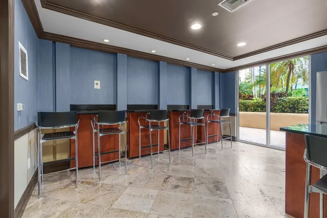a view of a livingroom with furniture and staircase